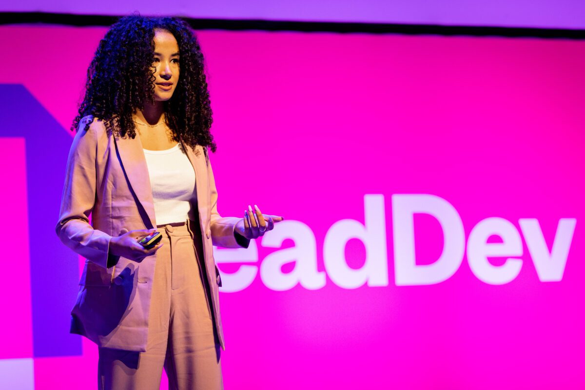 Jessie giving a talk at a conference.