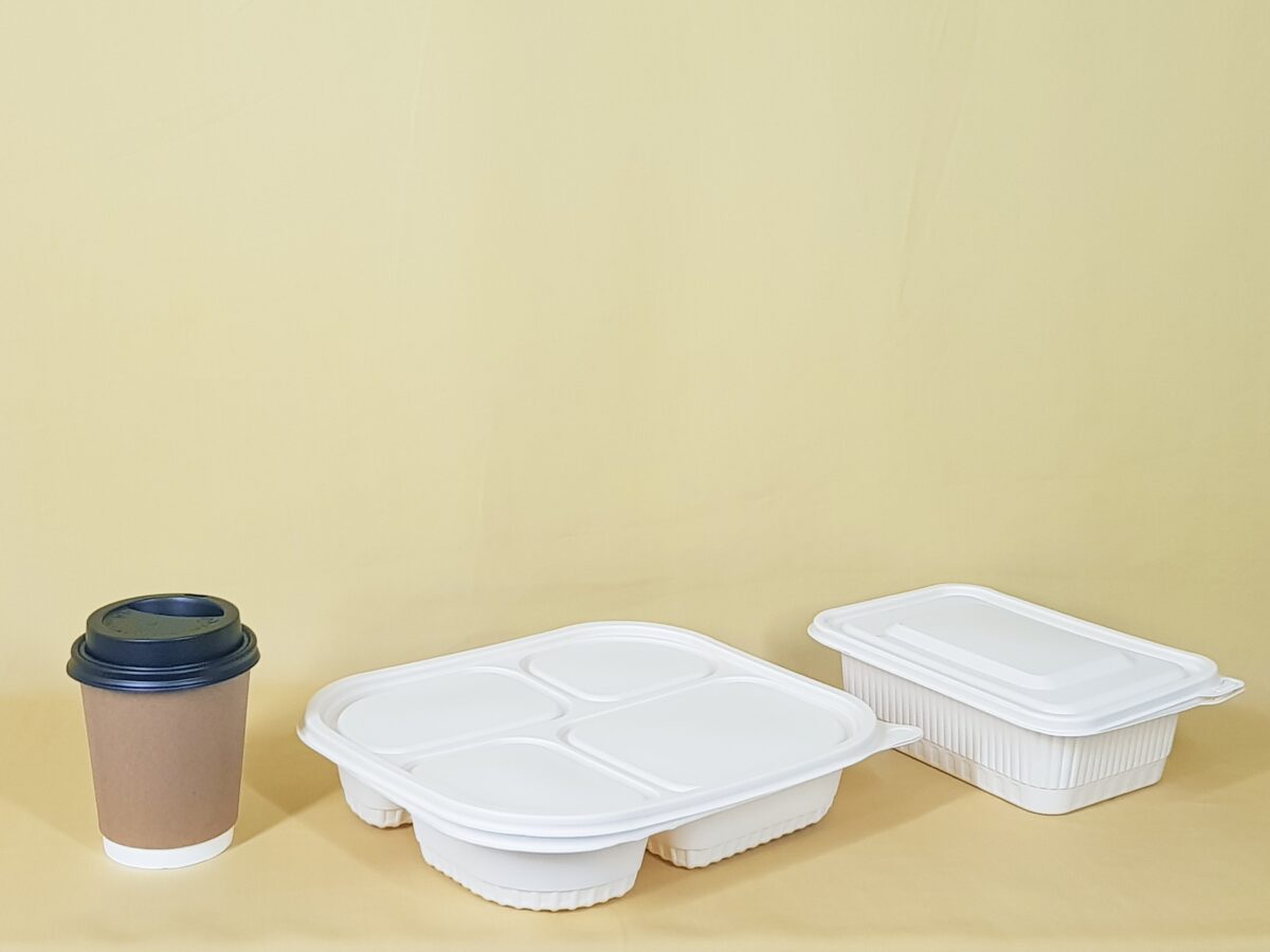 A takeaway coffee cup, and two different styles of cardboard takeaway food containers.