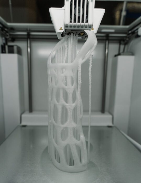 A 3D printer creating a model out of metal powder.