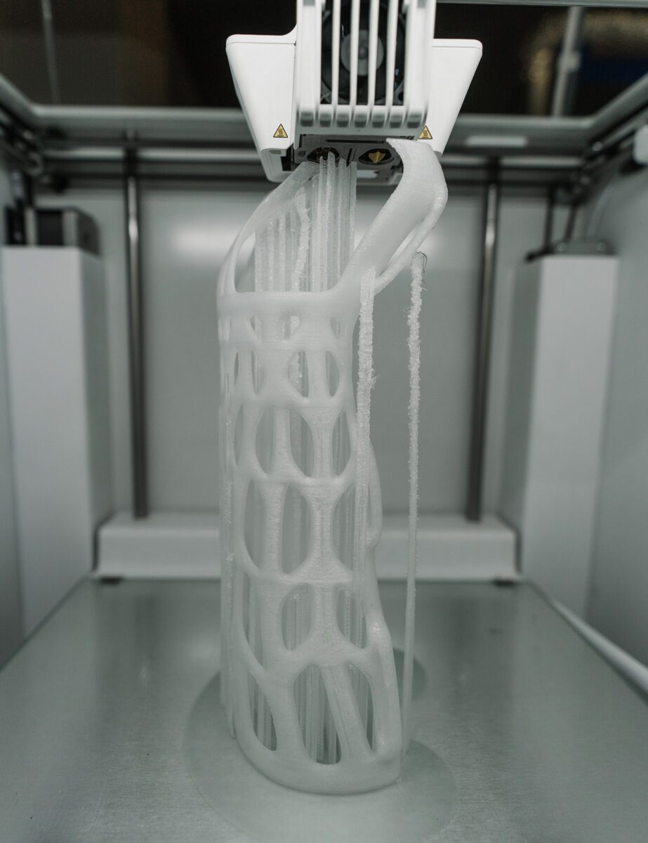 A 3D printer creating a model out of metal powder.