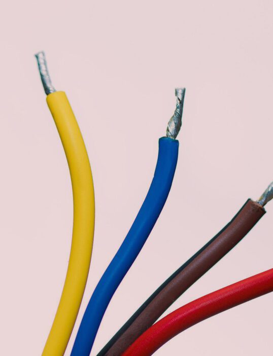 Four different coloured electrical wires.