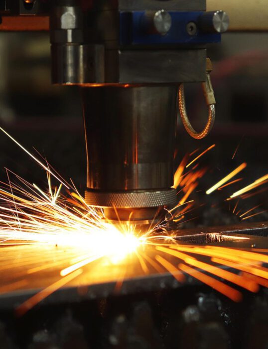 Manufacturing machinery creating sparks.