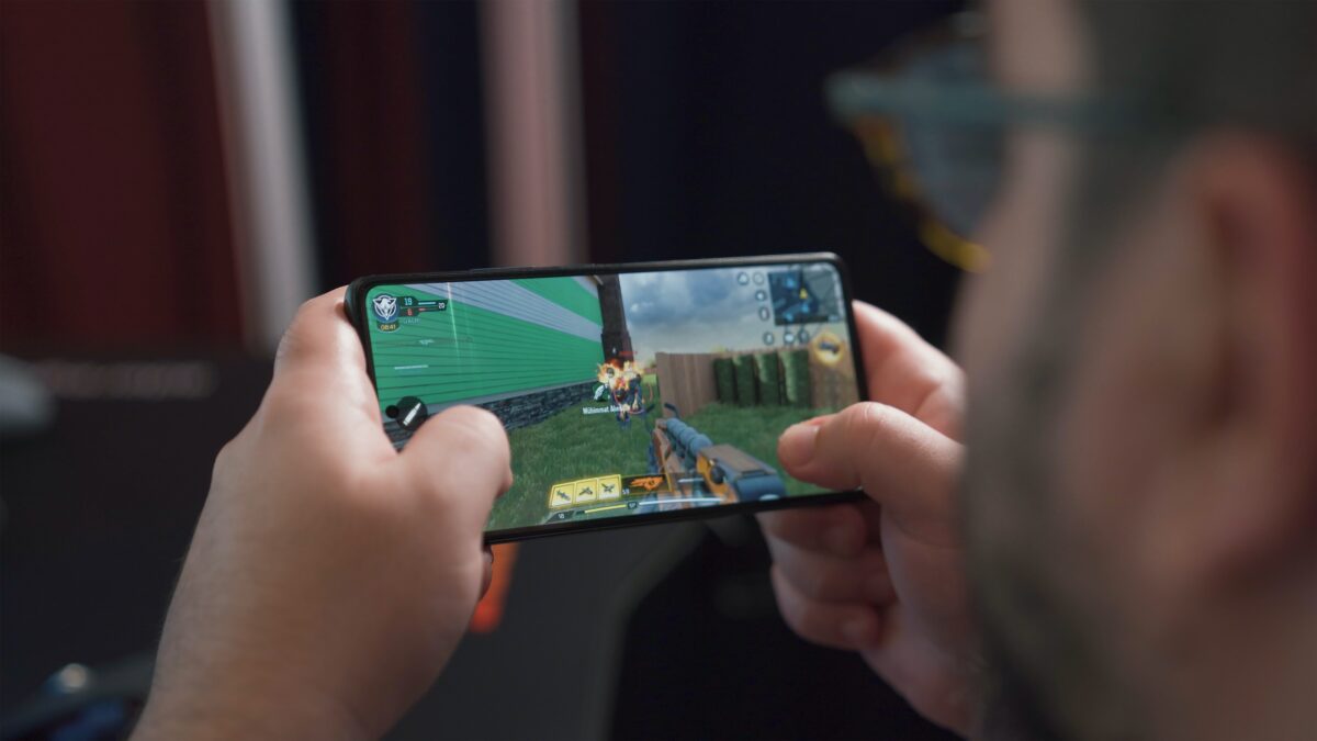 A person playing a game on their mobile phone.