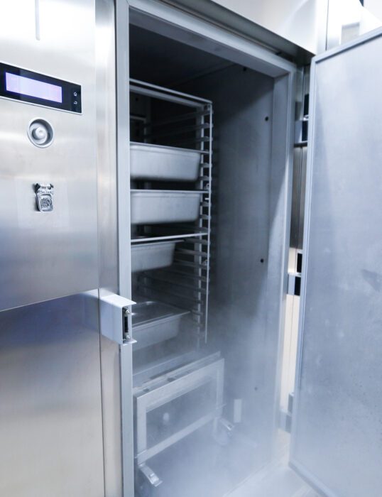 Industrial fridge with door open.