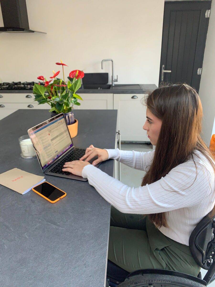 Holly working from home on her laptop.