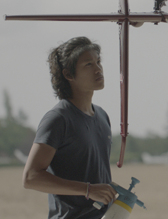 Adrian Ng working in an airfield.