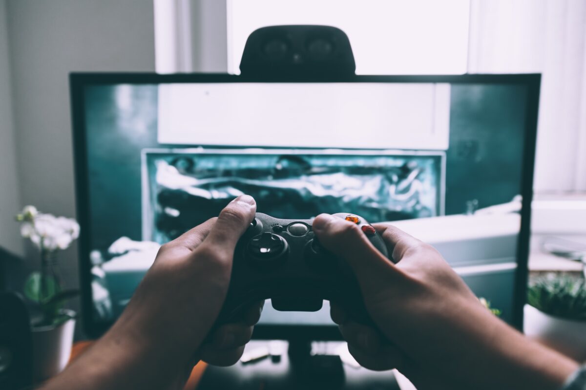 A person gaming on a games console.