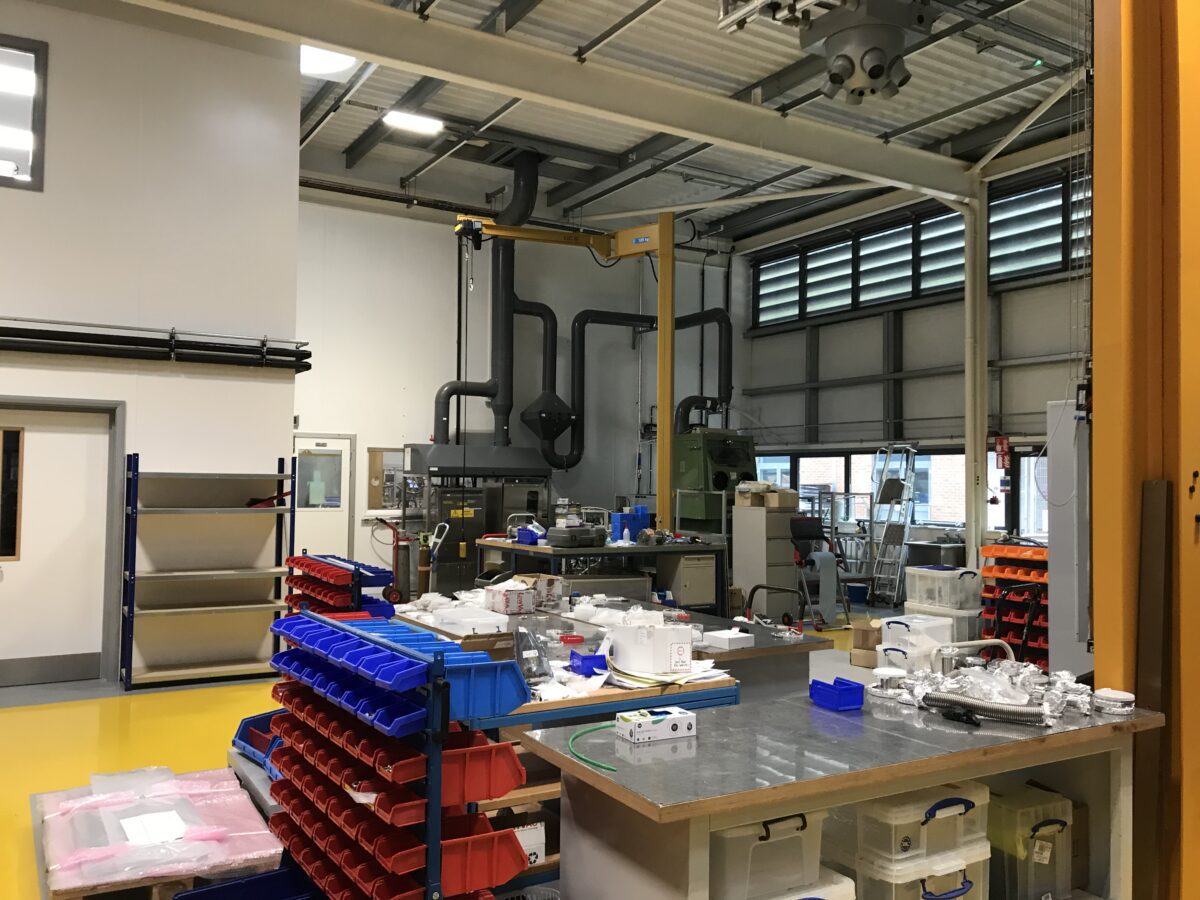 Ben Hool's workplace, a technical workroom containing workbenches, tools, and storage racks of equipment.