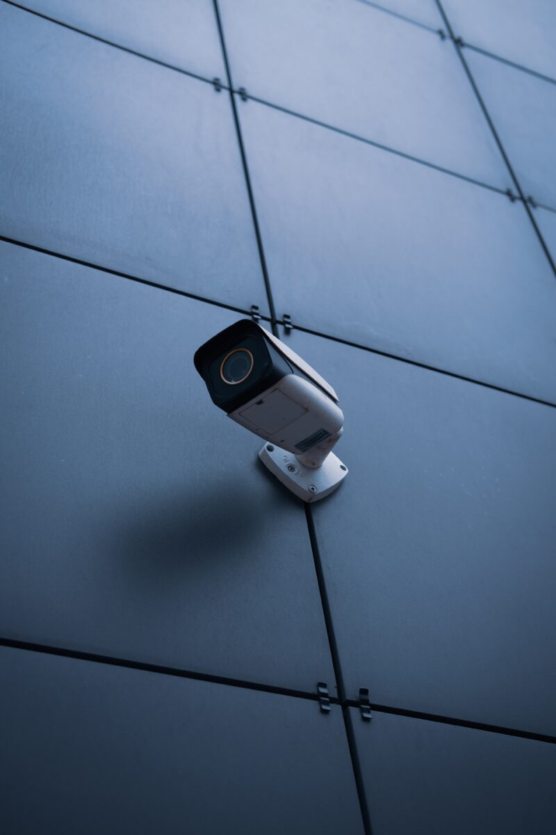 A security camera attached to a wall.
