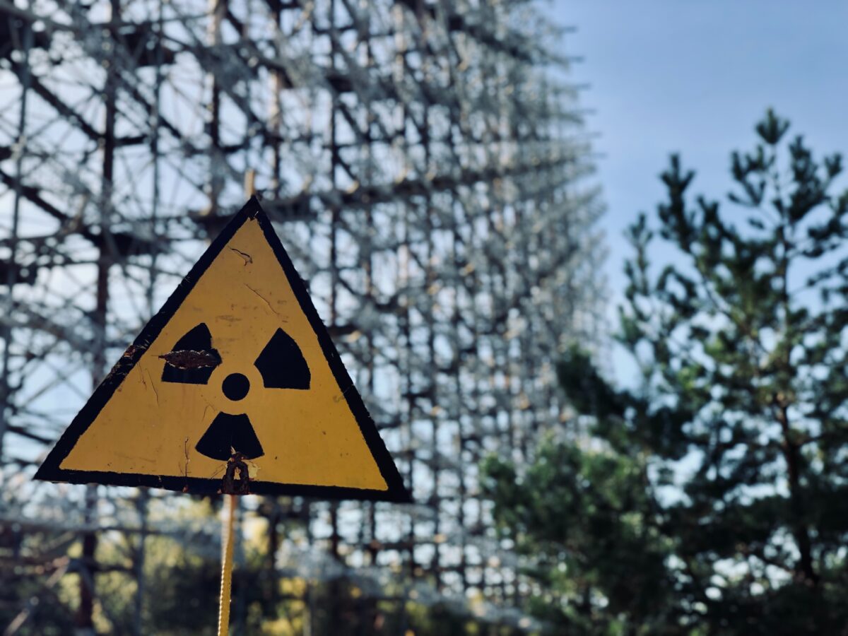 A radiation warning sign in a forest.