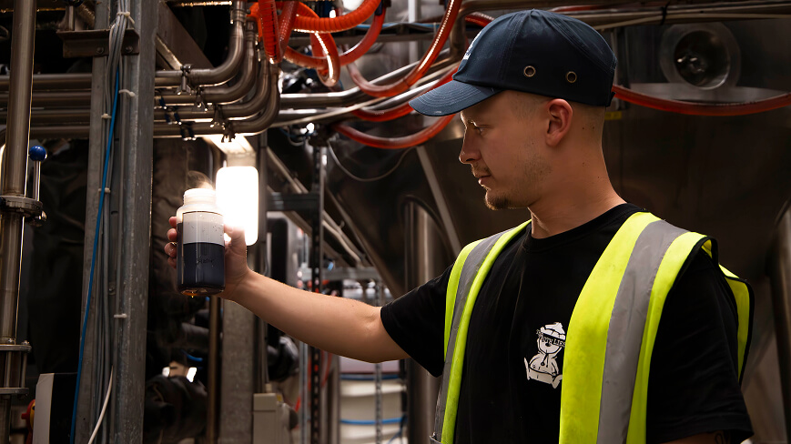 Max checking the brewing vats.