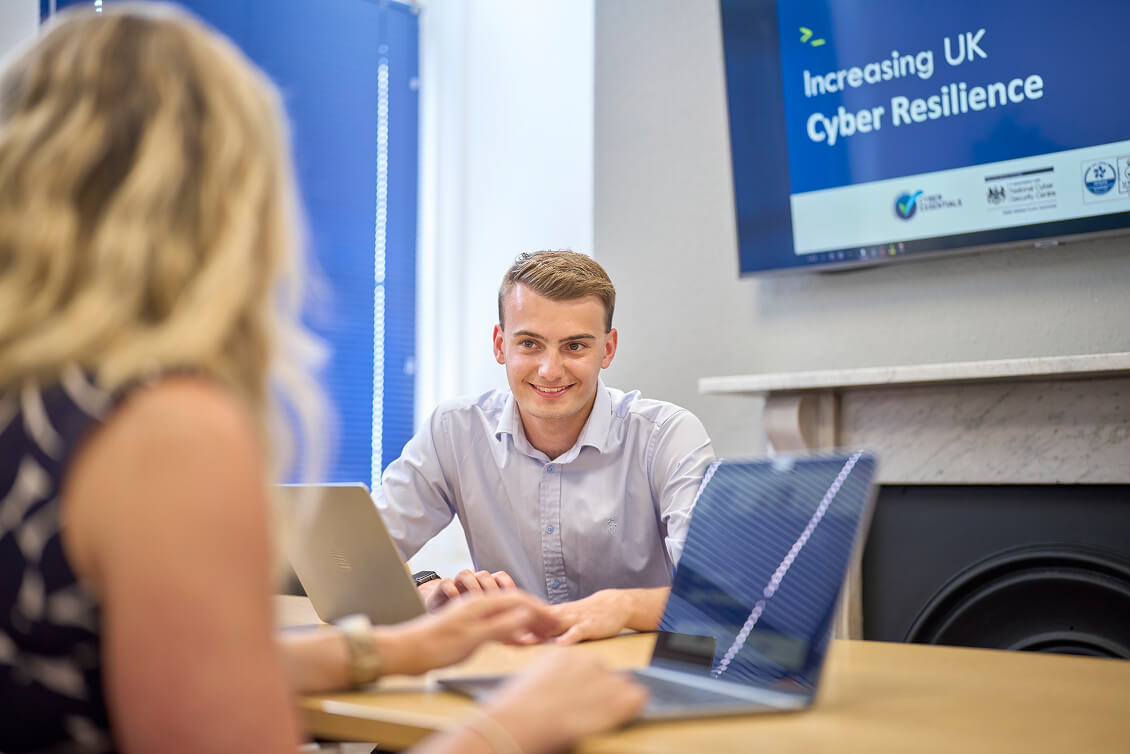 Alex in a meeting with a client.