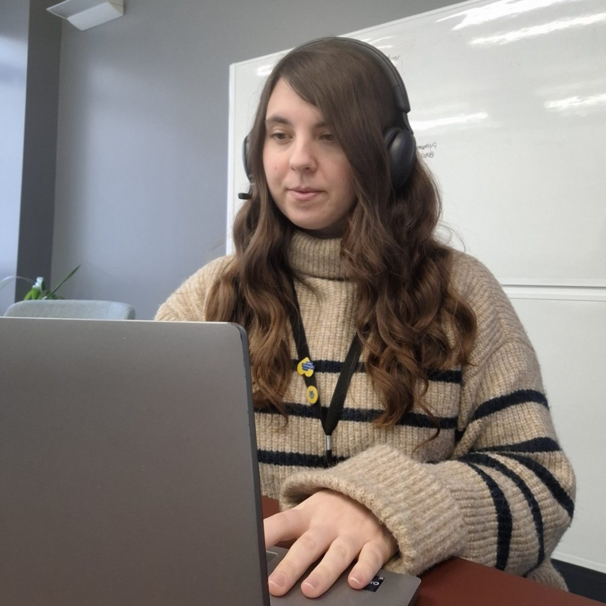 Software Developer Ria working at her laptop.