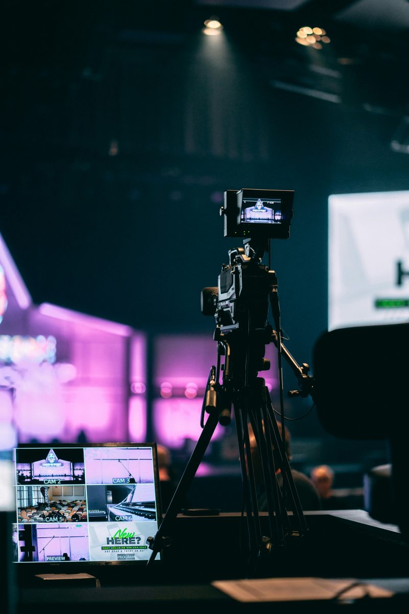 A camera on a tripod in a studio